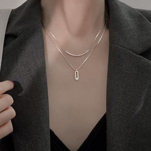Double necklaces go with simple necklaces